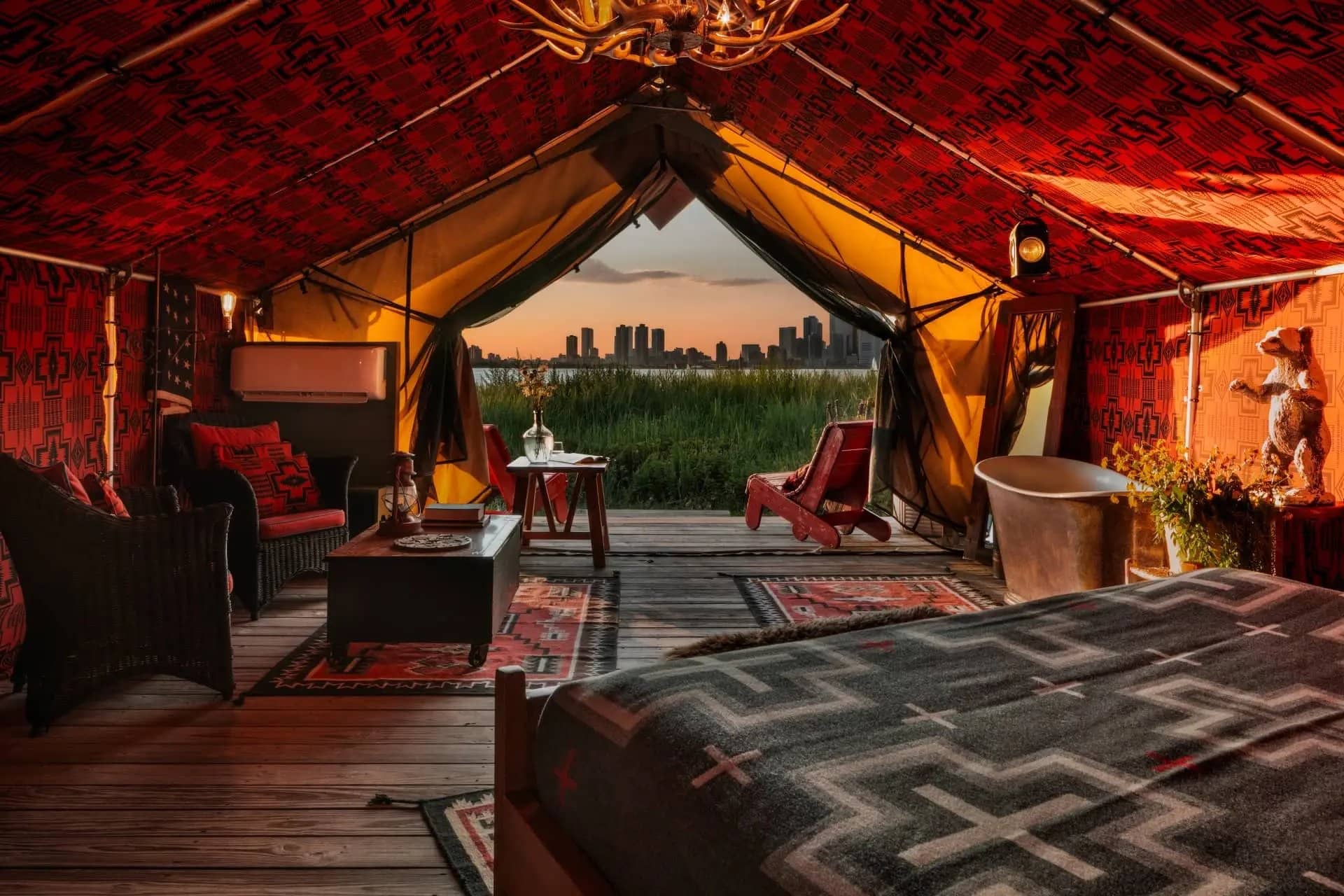 Inside the Urban Cowboy Tent on Governors Island, New York’s new waterfront glamping stay