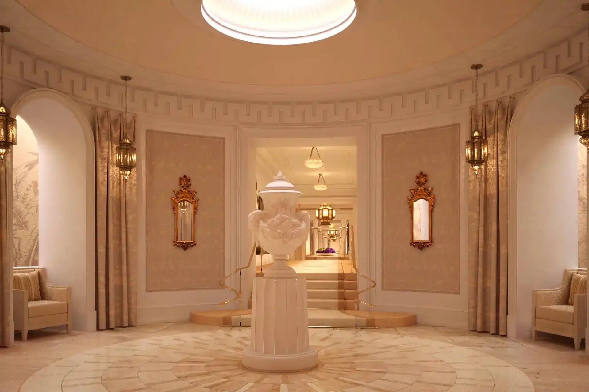 Ornate Royal Foyer with a central sculptural urn, marble floors, gilded wall lamps and cream seating