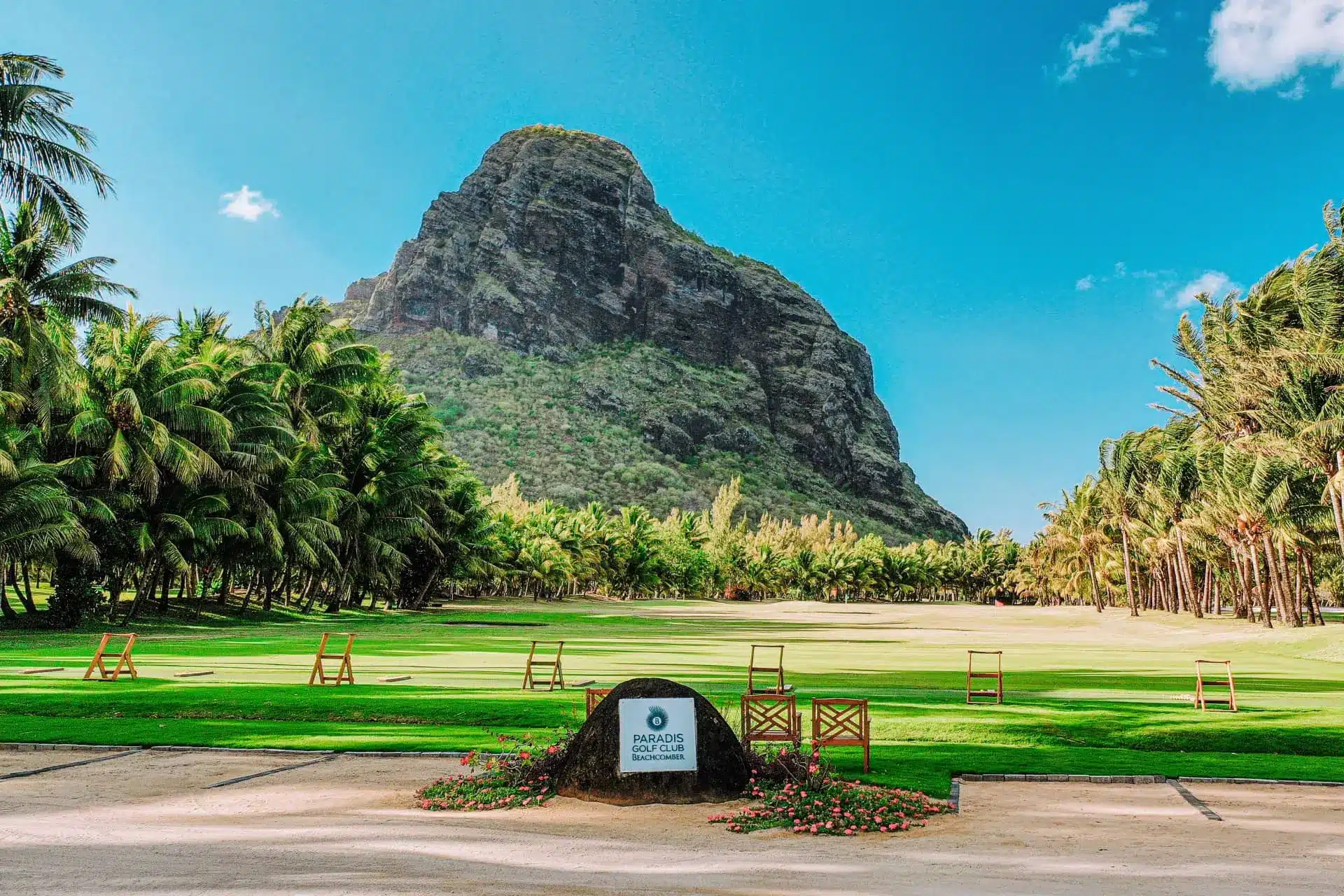 Paradis Golf Club fairway with Le Morne Brabant mountain and palm trees in Mauritius