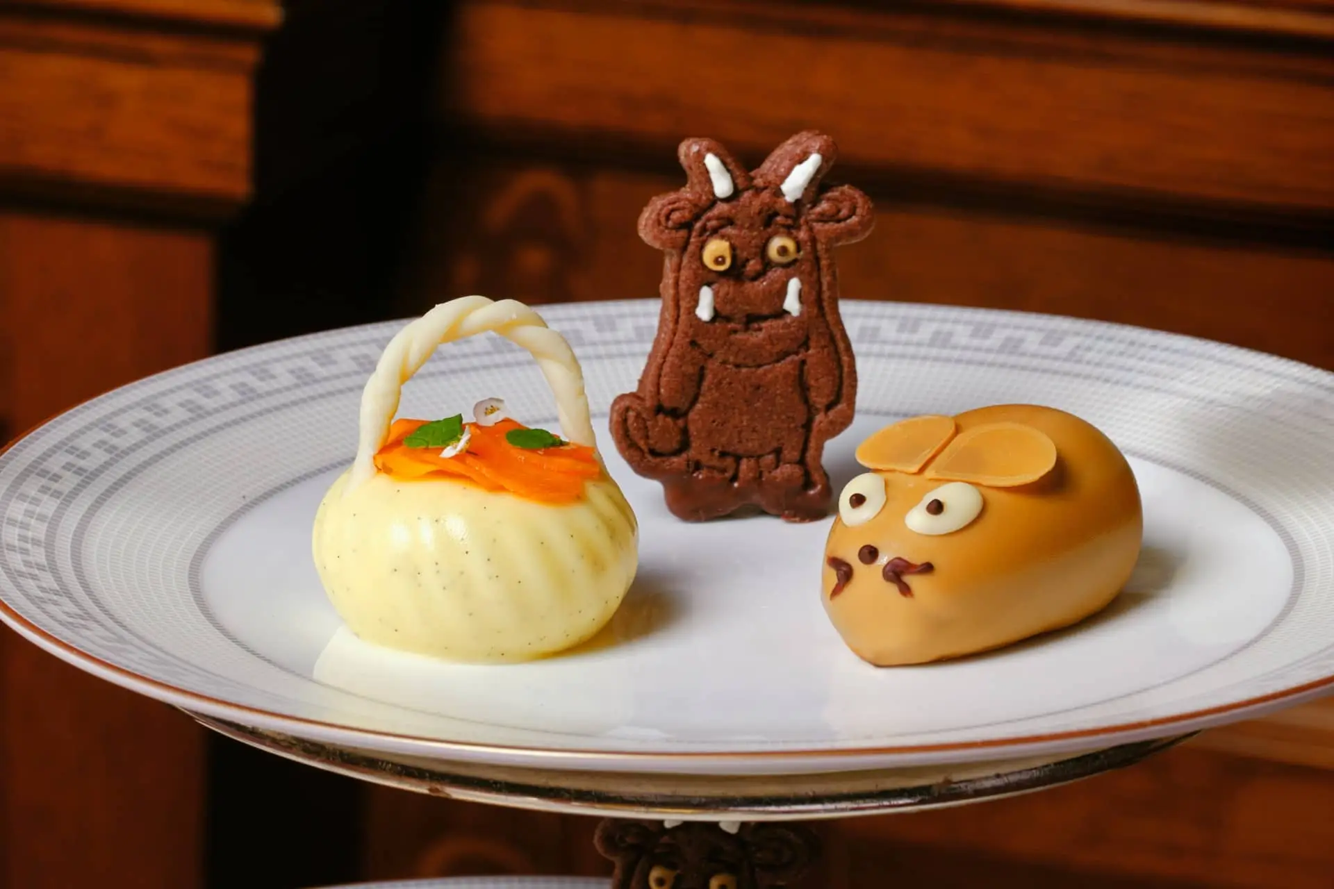 Gruffalo-themed afternoon tea with Gruffalo and mouse-shaped treats on a decorative plate