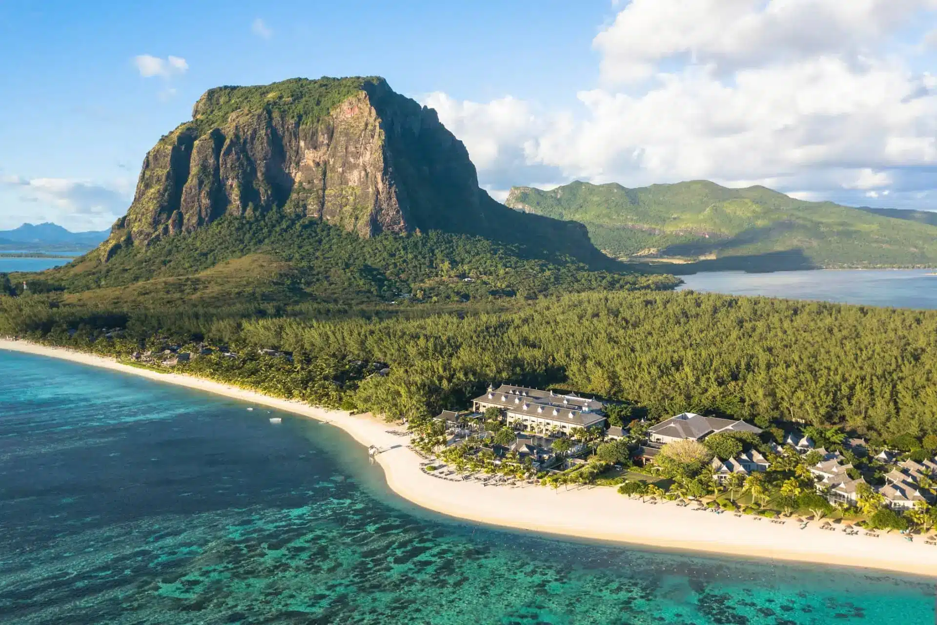 Aerial view of a luxury beachfront resort beneath Le Morne Brabant in Mauritius