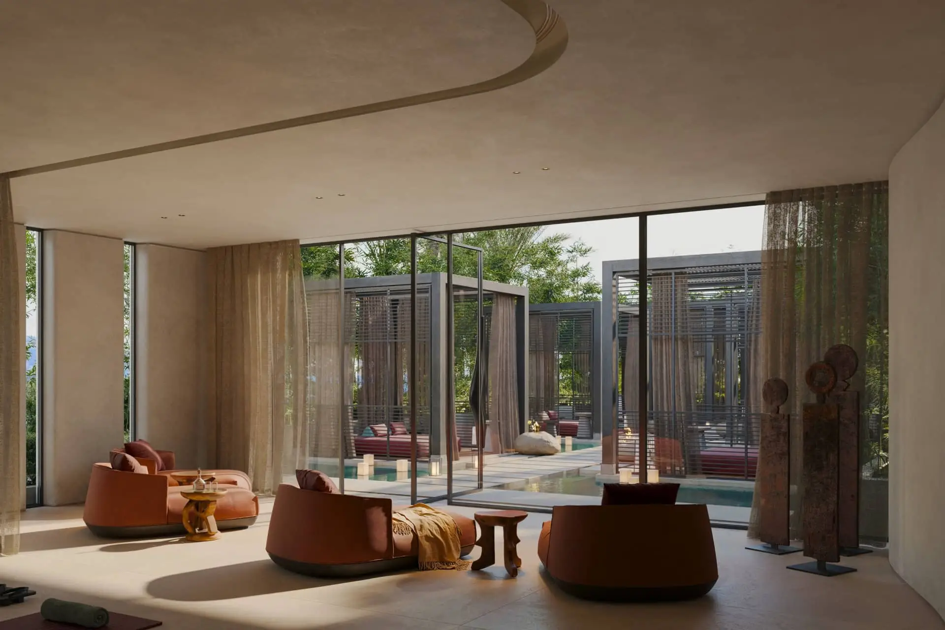 Modern lounge at Minos Palace Resort with orange seating and glass doors opening onto a pool courtyard